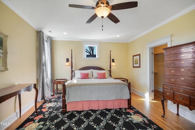 bedroom with visible vents, ceiling fan, baseboards, light wood-type flooring, and ornamental molding