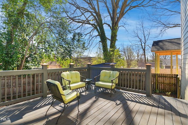 wooden deck featuring fence