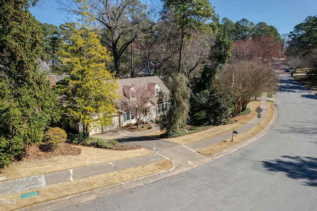 view of road featuring sidewalks and curbs