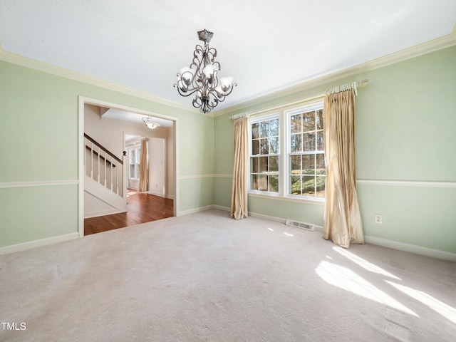 carpeted empty room with stairs, an inviting chandelier, and crown molding