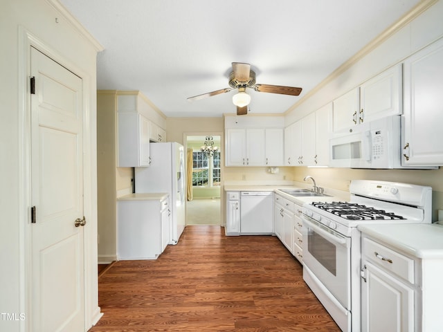 kitchen featuring a sink, dark wood finished floors, white cabinetry, white appliances, and ceiling fan