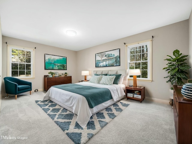 carpeted bedroom with baseboards