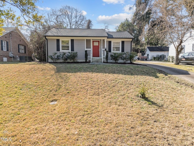 ranch-style home with central AC and a front lawn