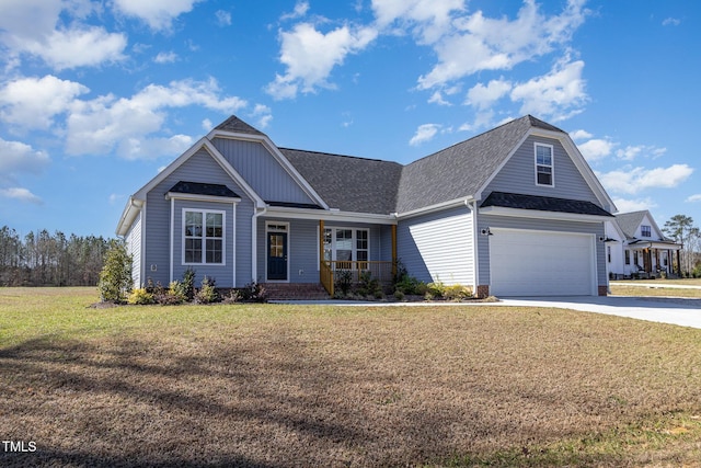 view of front facade featuring roof with shingles, covered porch, a front lawn, concrete driveway, and a garage