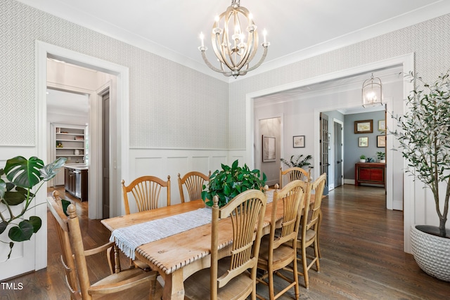 3337 Cheswick Dr, Raleigh, NC 27609 - dining room featuring a chandelier, wallpapered walls, dark wood-type flooring, a wainscoted wall, and crown molding