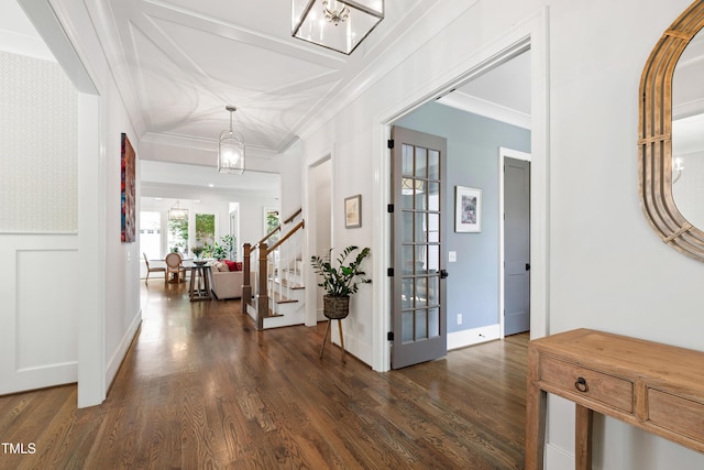 3337 Cheswick Dr, Raleigh, NC 27609 - foyer with dark wood-type flooring, ornamental molding, stairway, and a chandelier