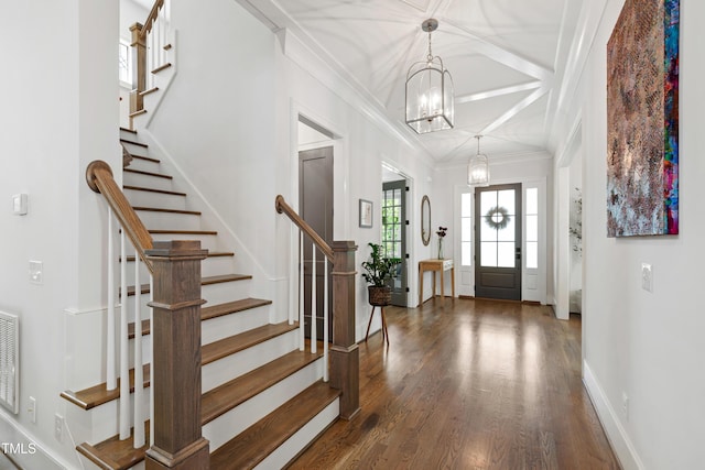 3337 Cheswick Dr, Raleigh, NC 27609 - foyer entrance with coffered ceiling, wood finished floors, a chandelier, stairway, and ornamental molding