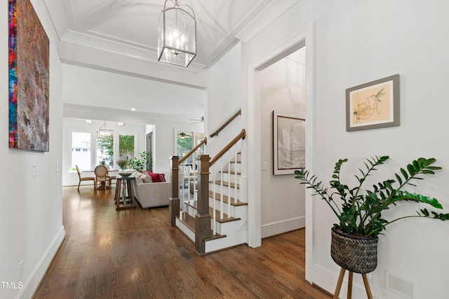 3337 Cheswick Dr, Raleigh, NC 27609 - foyer with a chandelier, dark wood-style flooring, stairs, and crown molding