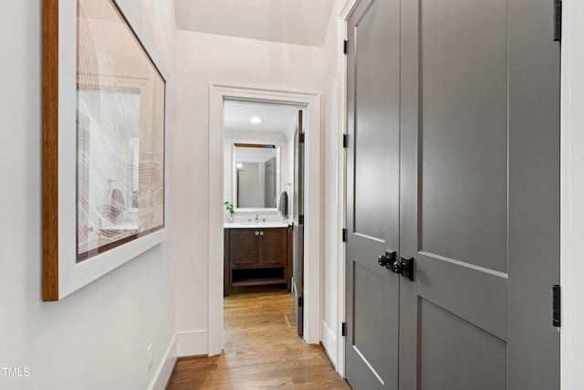 3337 Cheswick Dr, Raleigh, NC 27609 - hall with light wood-style flooring and baseboards