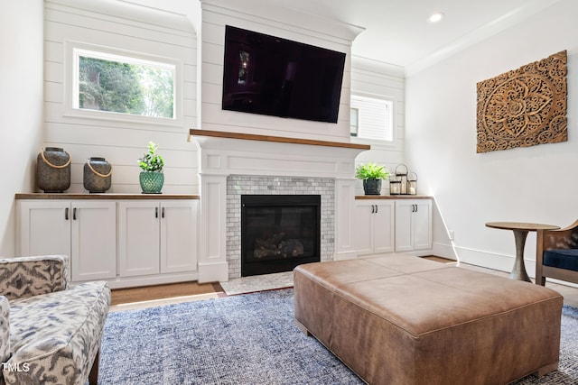 3337 Cheswick Dr, Raleigh, NC 27609 - living area with recessed lighting, wood finished floors, and a tile fireplace