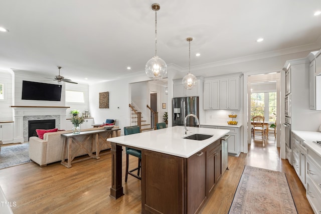 3337 Cheswick Dr, Raleigh, NC 27609 - kitchen featuring appliances with stainless steel finishes, ceiling fan, healthy amount of natural light, light countertops, and recessed lighting