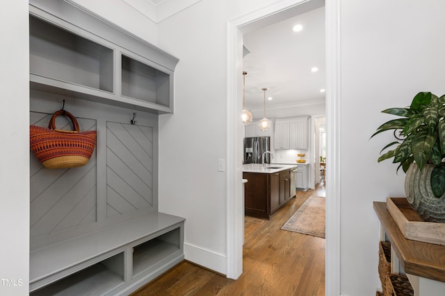 3337 Cheswick Dr, Raleigh, NC 27609 - mudroom featuring wood finished floors, crown molding, and recessed lighting
