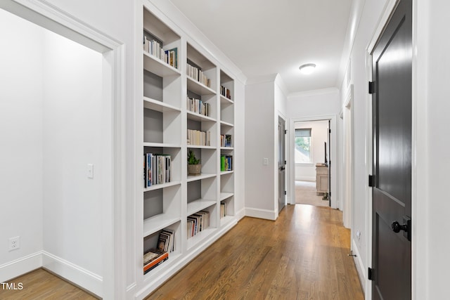 3337 Cheswick Dr, Raleigh, NC 27609 - corridor with wood finished floors and ornamental molding