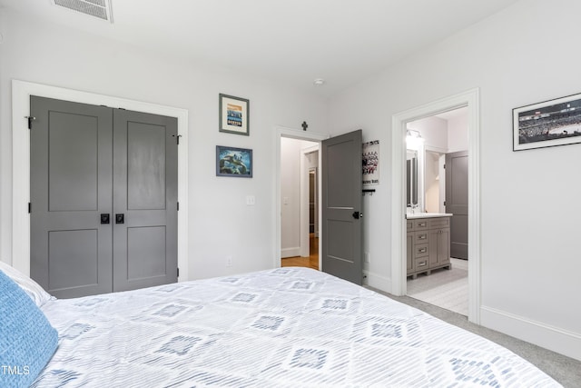 3337 Cheswick Dr, Raleigh, NC 27609 - bedroom with light colored carpet, a closet, and ensuite bath