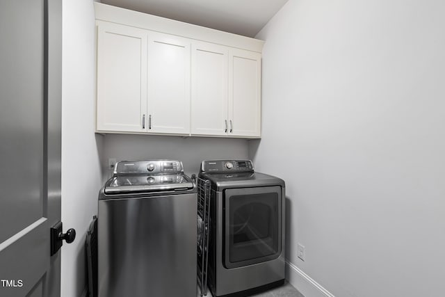 3337 Cheswick Dr, Raleigh, NC 27609 - washroom with washing machine and clothes dryer and cabinet space