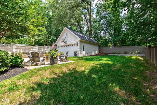 3337 Cheswick Dr, Raleigh, NC 27609 - fenced backyard with an outbuilding, a detached garage, and view of scattered trees