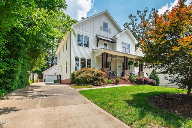 3337 Cheswick Dr, Raleigh, NC 27609 - modern inspired farmhouse featuring board and batten siding, covered porch, an outdoor structure, a front yard, and a garage