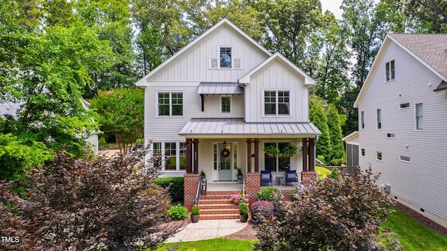 3337 Cheswick Dr, Raleigh, NC 27609 - modern inspired farmhouse with board and batten siding, a porch, a standing seam roof, and a metal roof