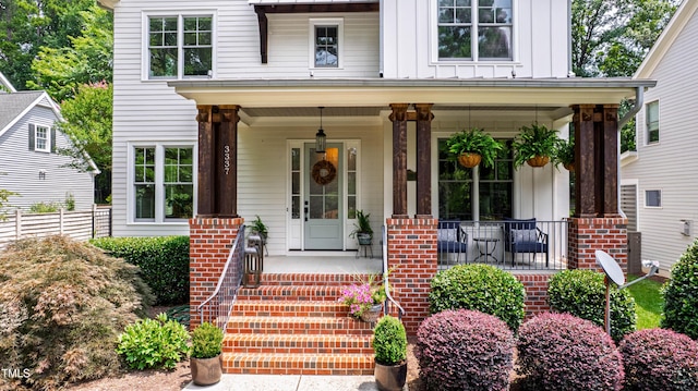 3337 Cheswick Dr, Raleigh, NC 27609 - property entrance with board and batten siding and covered porch