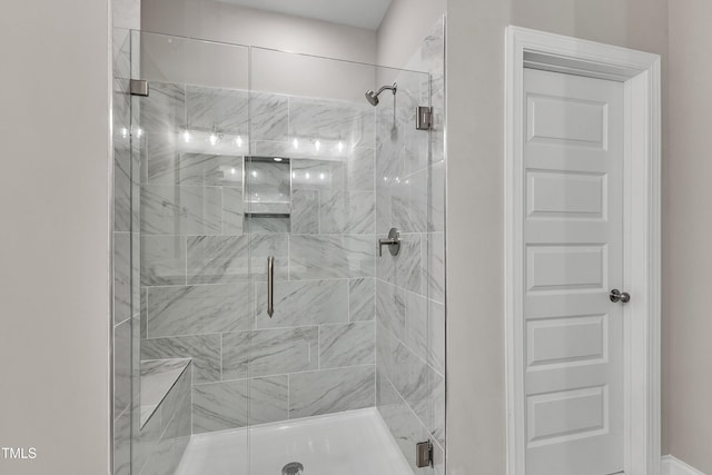 bathroom featuring a shower stall