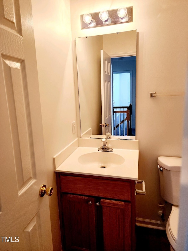 half bath with toilet and vanity