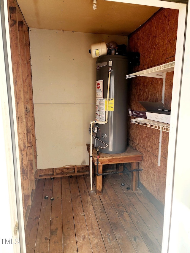 utility room with gas water heater