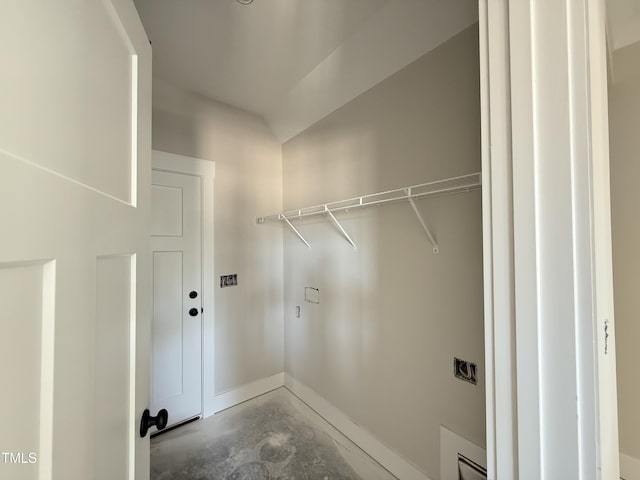 laundry area featuring baseboards