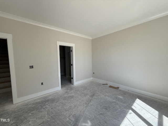 interior space featuring baseboards and ornamental molding