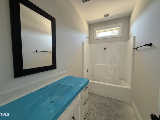 full bathroom with vanity, concrete floors, and shower / bathtub combination