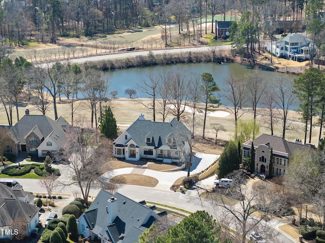 bird's eye view featuring a residential view and a water view