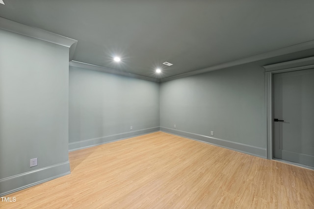 empty room with visible vents, recessed lighting, baseboards, and wood finished floors