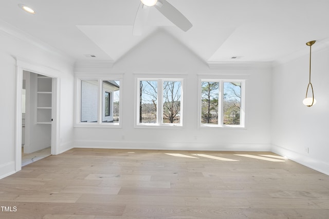 unfurnished room with plenty of natural light, light wood-style flooring, visible vents, and ceiling fan