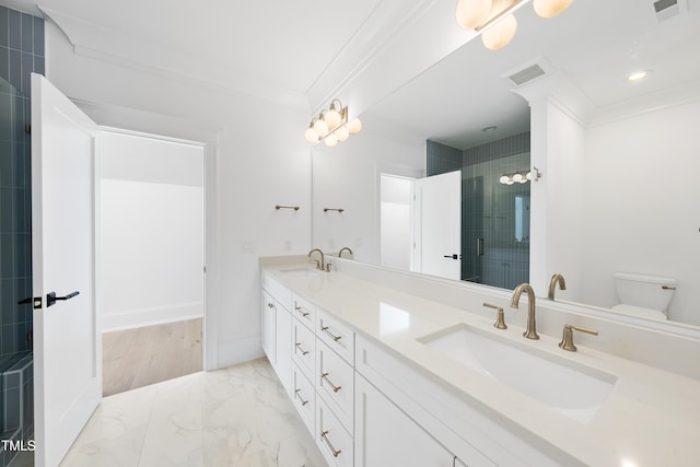 full bathroom featuring crown molding, marble finish floor, and a sink