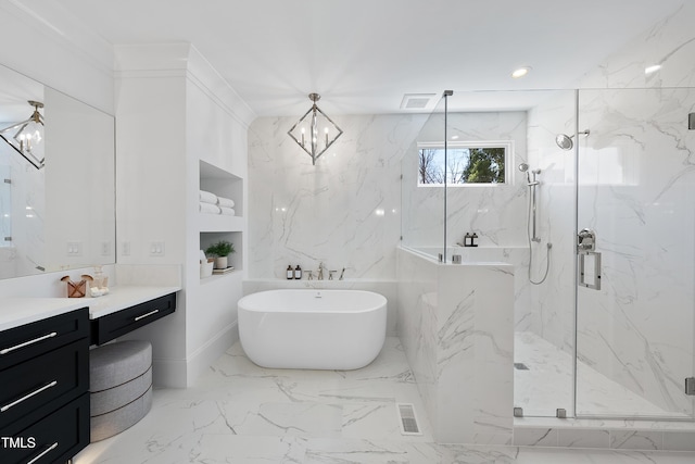 bathroom with a marble finish shower, a chandelier, a freestanding tub, marble finish floor, and vanity