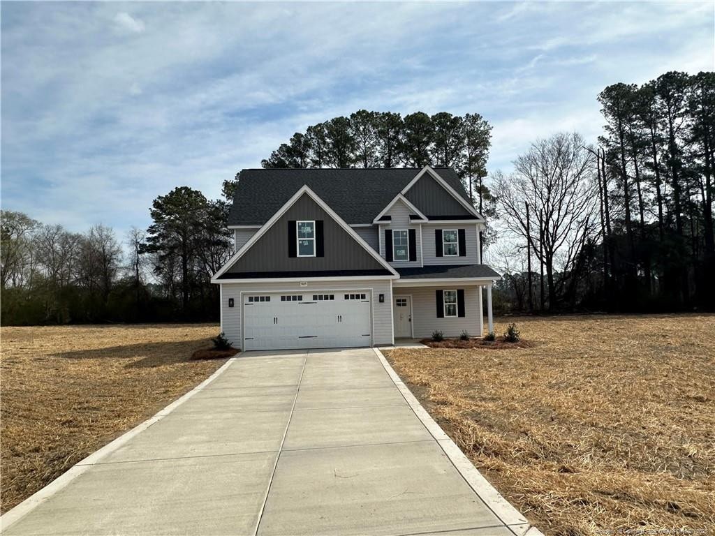 craftsman-style house featuring concrete driveway and a garage