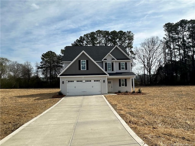 craftsman-style house featuring concrete driveway and a garage