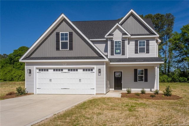 craftsman-style home featuring a porch, a front lawn, a garage, driveway, and roof with shingles