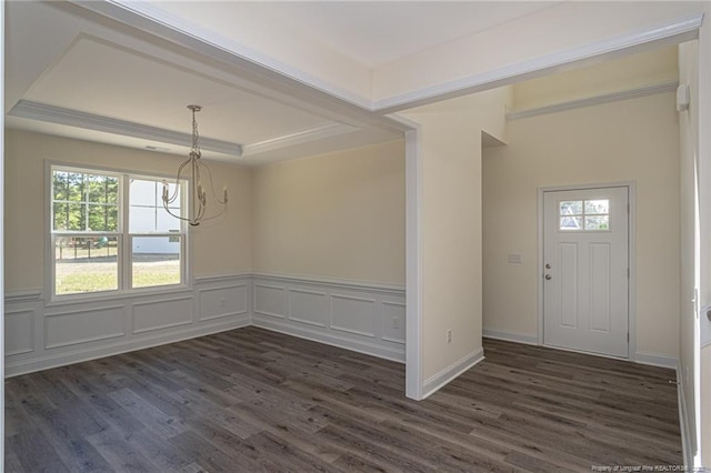 foyer entrance featuring dark wood-style floors, an inviting chandelier, and plenty of natural light