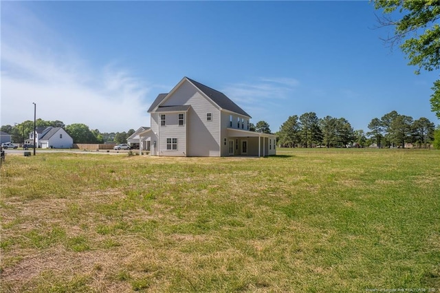 back of house with a yard