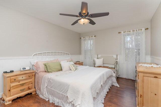 bedroom featuring ceiling fan and dark wood finished floors