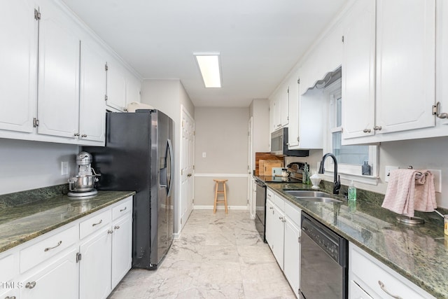 kitchen featuring black appliances, white cabinets, marble finish floor, and a sink