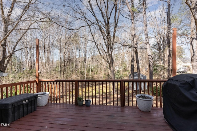 wooden deck with area for grilling