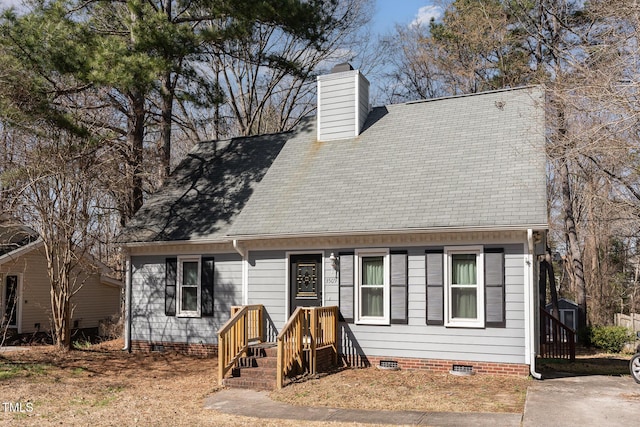 cape cod home featuring crawl space, a chimney, and a shingled roof