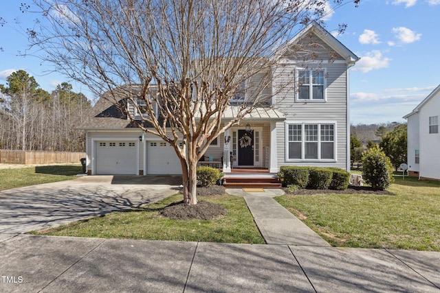 traditional-style home featuring a front lawn, an attached garage, a porch, and driveway