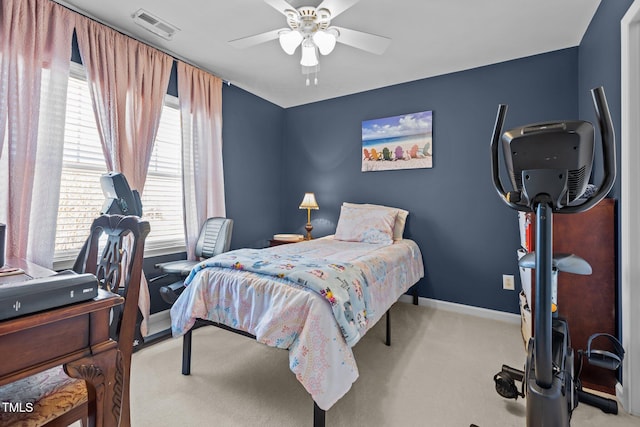 carpeted bedroom with baseboards, visible vents, and ceiling fan