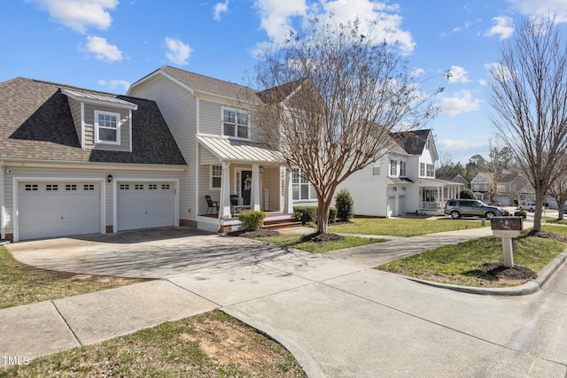 view of front of home featuring a shingled roof, a residential view, concrete driveway, a front yard, and an attached garage