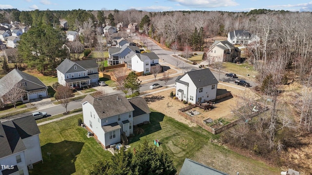 aerial view featuring a residential view and a wooded view