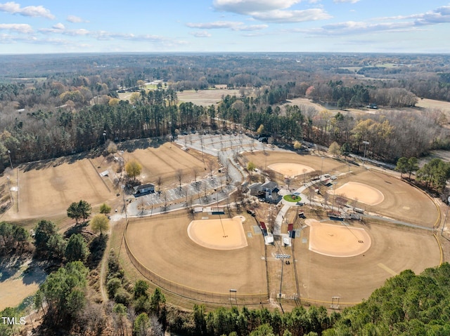 drone / aerial view featuring a view of trees