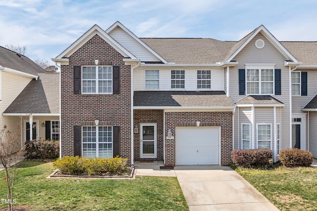 view of front of home featuring driveway, a shingled roof, a front lawn, a garage, and brick siding