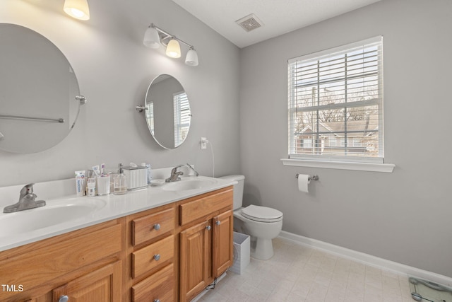 full bathroom with a healthy amount of sunlight and a sink